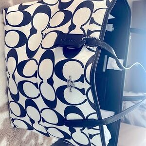 New 
Available 
Black and whiter Coach Bag 
Never been used  Beautiful